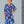 Load image into Gallery viewer, Woman wearing a designer blue floral dress sewn from vibrant floral printed silk
