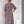 Load image into Gallery viewer, Woman wearing a patterned silk shirt dress with a sewing pattern illustration on the side.
